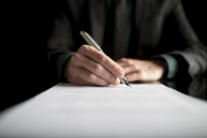 closeup-of-lawyer-or-executive-signing-a-contract-PK4B783_resized closeup-of-lawyer-or-executive-signing-a-contract-PK4B783_resized