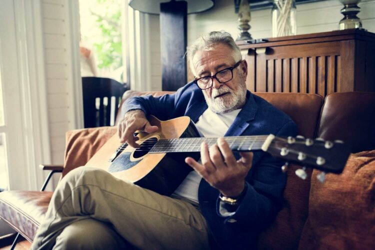 an-elderly-man-is-playing-guitar-P9YDZF6_resized elderly loved ones